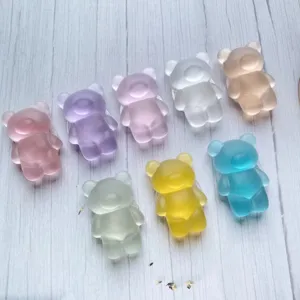 Detailed view of eight colorful frosted bear-shaped expandable phone grips.