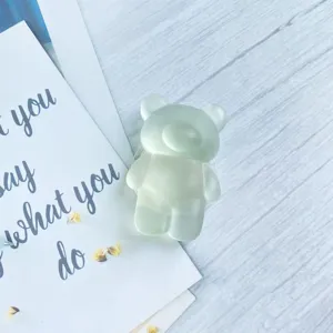 Close-up detail of a mint green frosted bear-shaped telescopic phone grip bracket