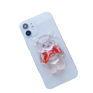 Supporto per telefono a forma di orso trasparente con fiocco rosso su cover blu