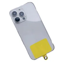 Universal yellow phone lanyard patch with metal ring inside clear iPhone case