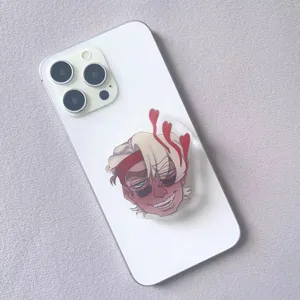Close-up detail of a stylized character acrylic air cushion pop socket phone stand.