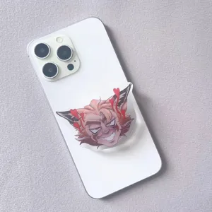 Detail view of a cartoon anime character acrylic resin retractable phone grip on a white phone