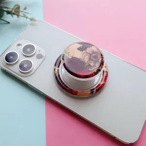 Close-up of magnetic phone grip with elegant painted rose flower pattern on white phone
