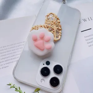 Close-up of a cute 3D cat paw squishy phone grip bracket on a transparent phone case