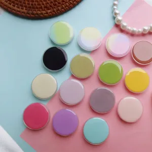 Gedetailleerde weergave van ronde macaron telefoonhouders met glanzende afwerking op pastel