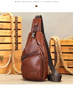 Brown leather chest bag detail showing multi-zipper pockets, adjustable strap and hardware.