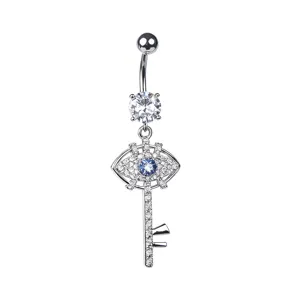 Detailed view of silver evil eye key navel piercing with blue and clear zirconia stones.