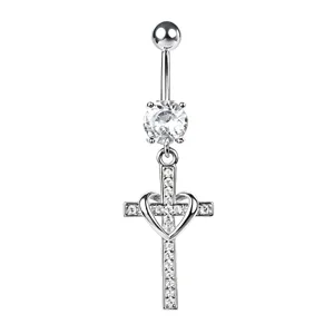 Detailed shot of a silver-tone cross navel ring with heart and clear zircons.