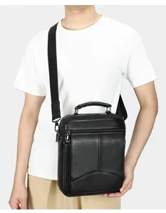 Black genuine leather vertical men's crossbody bag with zipper and adjustable shoulder strap.