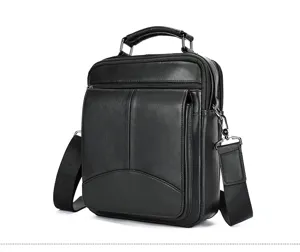 Men's black leather vertical crossbody shoulder bag detail, premium cowhide business style.