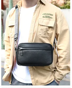 Detailed view of black genuine leather men's crossbody bag with adjustable strap.
