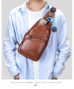 Detailed view of brown leather chest bag with sunglasses holder and multi-functional storage.