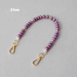 High-quality detail view of 37cm purple acrylic beaded strap with gold lobster clasps