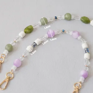 Close-up of acrylic bead chain with 1.6cm and 1.2cm diameter measurement markers