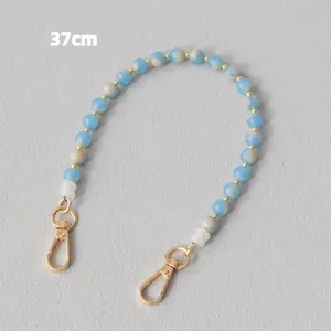 Catenella da 37 cm in perle acriliche per telefono o borsa con perle marmorizzate blu.