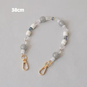Close-up of 38cm decorative acrylic bead strap with grey glitter beads and gold clasps