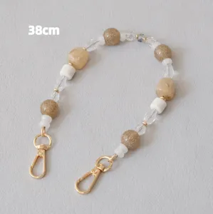Detailed view of a 38cm beaded resin chain strap featuring gold-tone lobster clasps