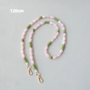 Bandoulière perlée en acrylique de 120 cm, rose et vert, avec fermoirs dorés.