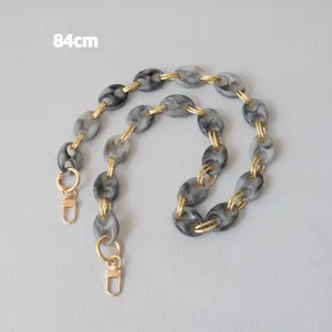 Detailed view of 84cm gray marbled resin pig nose chain strap with gold lobster clasps