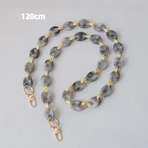 Detail view of a 120cm marble grey resin chunky bag strap with gold lobster clasps