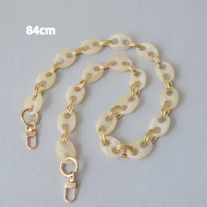 Close-up of 84cm marbled resin pig nose chain strap with gold lobster clasps