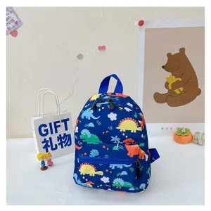 Cute navy blue children's backpack featuring colorful dinosaur patterns in a lifestyle setting