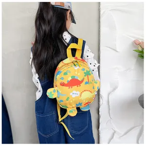 Little girl wearing a cute yellow dinosaur backpack in a casual lifestyle setting