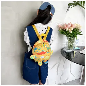 Yellow dinosaur pattern kids backpack displayed on a child model for school or travel use