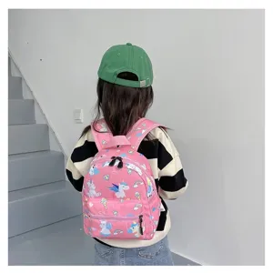 Cute pink schoolbag with unicorn patterns worn by a girl in a casual indoor setting