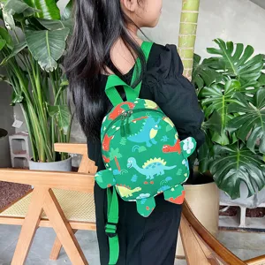 Cute green children's backpack with colorful cartoon dinosaur prints for school or travel