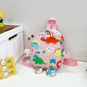 Cute pink cartoon dinosaur backpack for children featuring creative 3D limb design for school