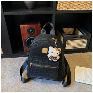 Schicker schwarzer Rucksack mit Leopardenmuster und niedlichem Plüsch-Anhänger für Damen