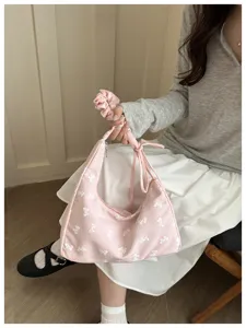 Sweet pink checkered underarm shoulder bag with bow print and matching scrunchie accessory