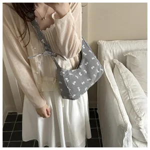 Close-up detailed view of sweet vintage gingham shoulder bag with bowknot prints