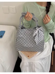 Grey polka dot tote bag with floral ribbon detail and woven braided handles for daily use