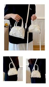 Detailansicht einer weißen gepunkteten Spitzenhandtasche mit Schleifen und Gurtband
