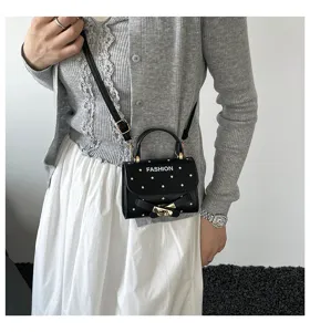 Cute black polka dot small square bag featuring fashion print and elegant belt buckle detail