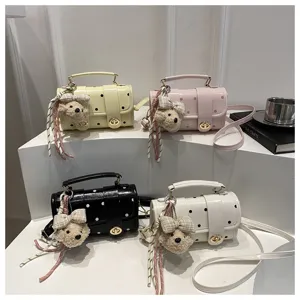 Set of cute polka dot pillow bags with plush teddy charms in four stylish pastel colors