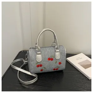 Fashionable denim handbag with cherry embroidery and silver metallic handles for women