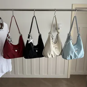 Minimalist casual hobo bags in four colors featuring star pendants and bow detailing
