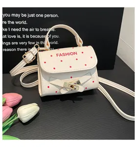Cream-colored polka dot small square handbag with fashion buckle and red polka dots