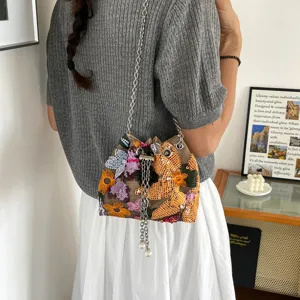 Vintage Chinese style bucket bag with floral embroidery and sequins and chain strap