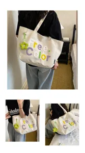 Canvas tote bag detail showcasing embroidered letter design and cute flower pendant in daily use.