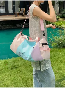 Large capacity travel duffel bag for women, lightweight waterproof sports gym bag for short trips.
