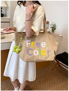 Canvas tote bag with colorful embroidered letters, casual style shoulder bag for daily use.