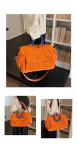 Large capacity travel duffel bag, orange canvas gym and shoulder bag for short trips.