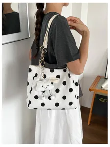 Stylish large capacity polka dot tote bag with cute cloud charm in lifestyle setting