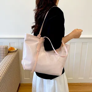 Fashionable large pink patent leather tote bag with unique crinkled texture for women
