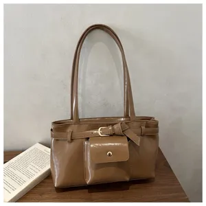 Elegant retro brown soft faux leather tote bag featuring front pocket detail and buckle