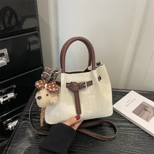 Retro canvas bucket bag with brown leather trim and cute bear charm pendant